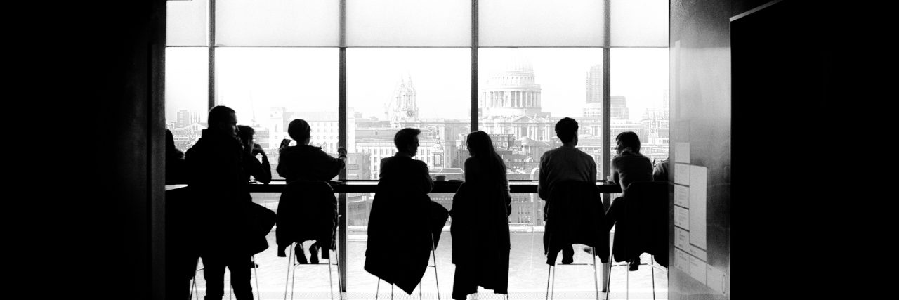 When Anxiety Convinces Me I Don't Belong people at a meeting