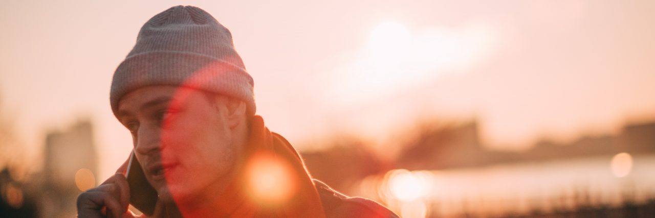 10 Ways to Support a Friend With Mental Illness When You're Apart man on the phone