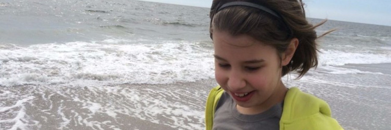 When Someone Asks My Medically Complex Daughter What She Wants To Be When She Grows Up Katherine Erby's daughter on the beach.