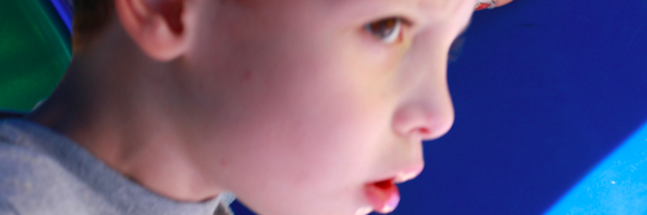 10 Things I Love About My Autistic Child little boy on the slide