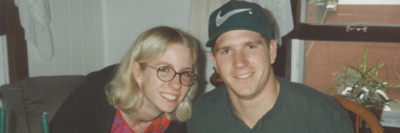 On Surviving the Suicide of My Twin Brother, 20 Years Later image of contributor and twin brother Andrew with celebration cake