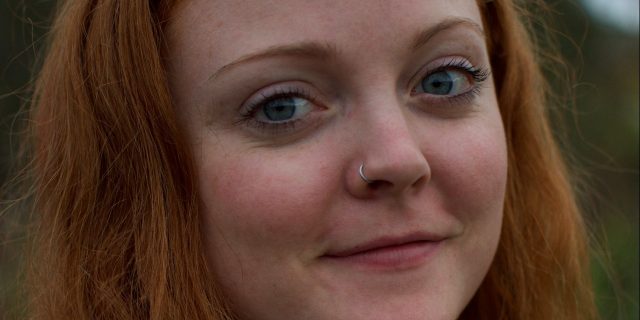 What I Would Tell My 9-Year-Old Self Who Wrote, 'I Want to Die' young woman with red hair