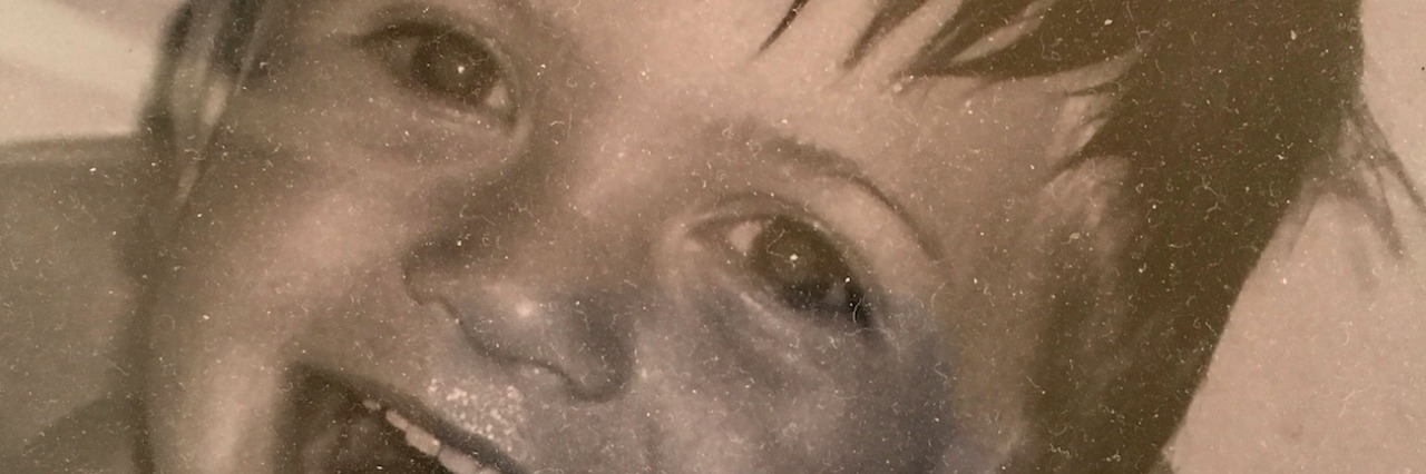 Reflections as My Son on the Autism Spectrum Becomes a Teenager Black and white photo of author's son as a child