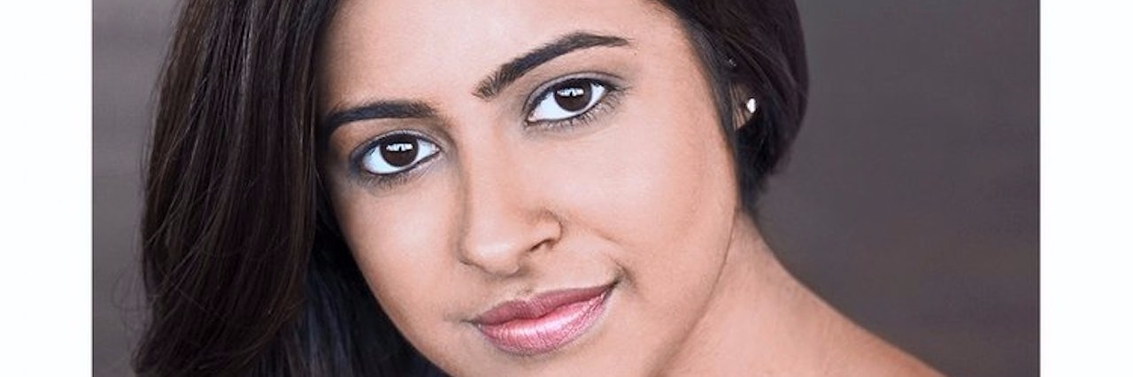 The Everyday Challenges of a Person With Autoimmune Hepatitis woman smiling