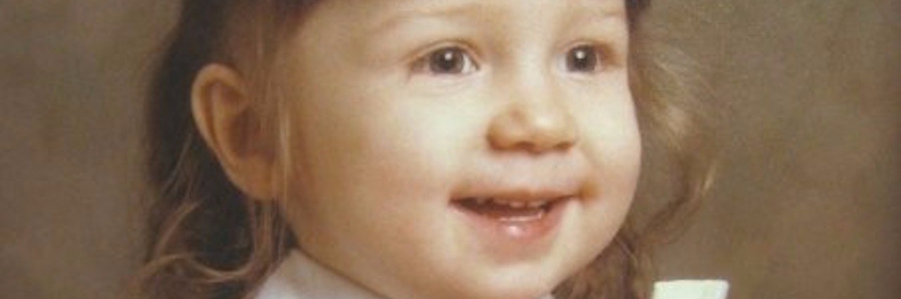 What I Would Tell My Younger Self About Life With Crohn's Disease photograph of young girl smiling