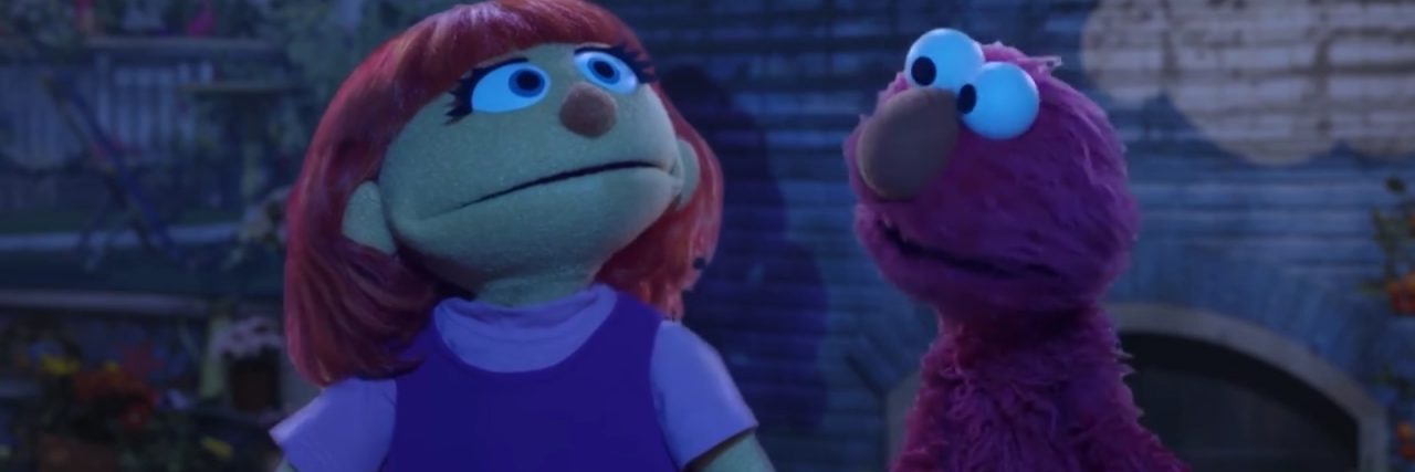 Why Sesame Street's Julia Is a Step in the Right Direction Picture of Elmo and Julia on a dark night