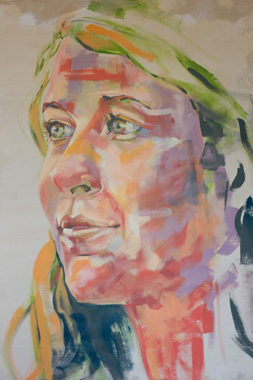 Colorful painting of a woman's face.