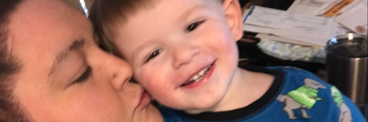 What Parenting With Depression Teaches My Son mom kissing young son in pajamas