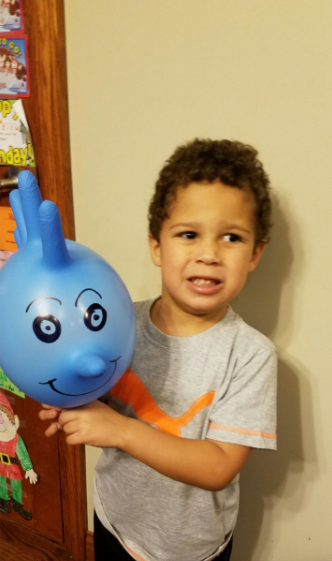 boy playing with medical gloves