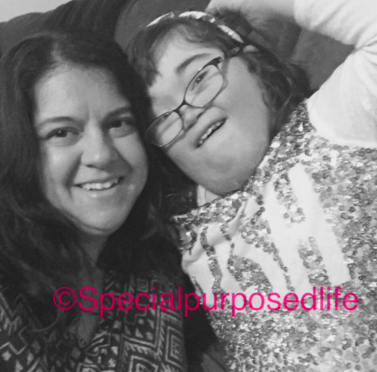 Black and white photo of mom and daughter with [@specialpurposedlife] on the photo