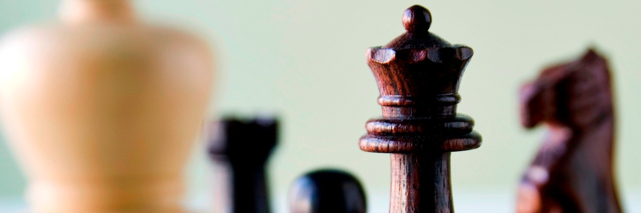 Asperger's and Intimacy Through Chess Wooden chess pieces on chess board