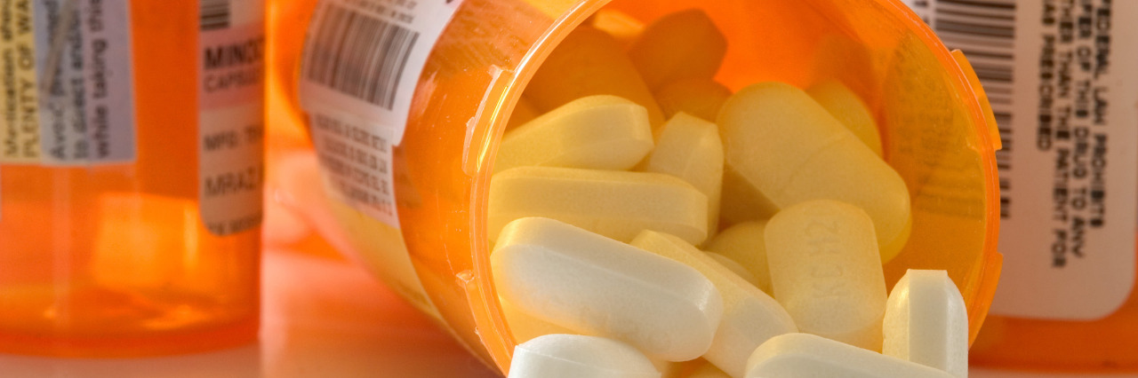 Why to Oppose Step Therapy for Chronic Conditions Pills spilling from bottle.