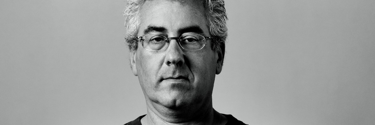 Getting and Accepting an Anxiety Diagnosis in My 50s Portrait of middle aged serious man with arms folded.