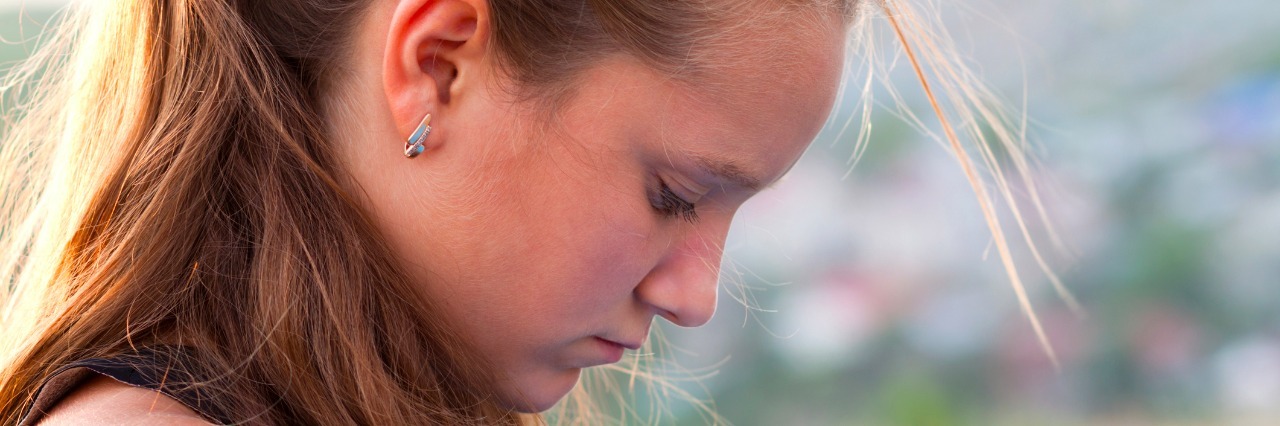 Why I Love and Despise the Days I'm Not Consumed With Overthinking Sad teen outdoors