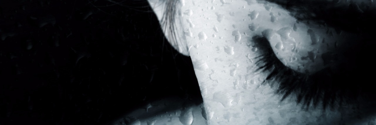 The Many Aspects of Bipolar Disorder woman looking upset with drops of rain monochrome