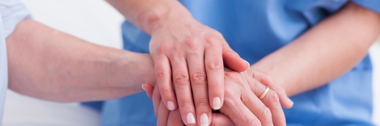 Thank You to the Nurse Who Comforted Me When I Was Depressed Close up of a nurse touching hand of a patient
