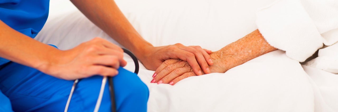 The Best Thing a Nurse Said About My Rare Disease medical doctor holding patient's hands and comforting her