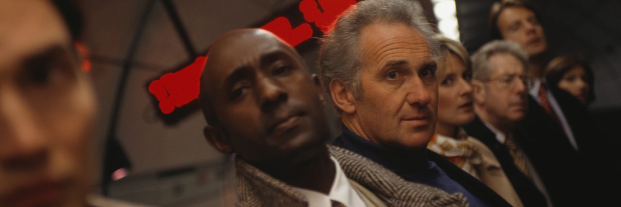 To the Man on the Tube Who Stopped (and Saved My Life) on a Dark Day Businesspeople waiting at underground platform