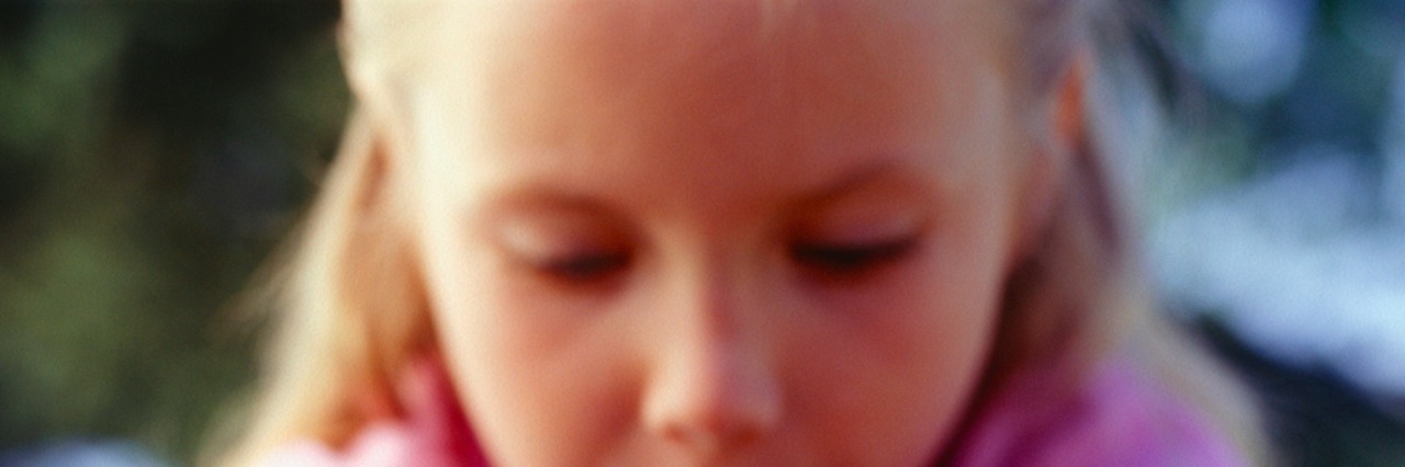 I Experienced Sexual Abuse but I Don't Remember It A young girl tying her shoes