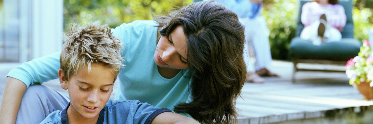 When My Son With Autism Asked If He Has a Disability Mother sitting with son.