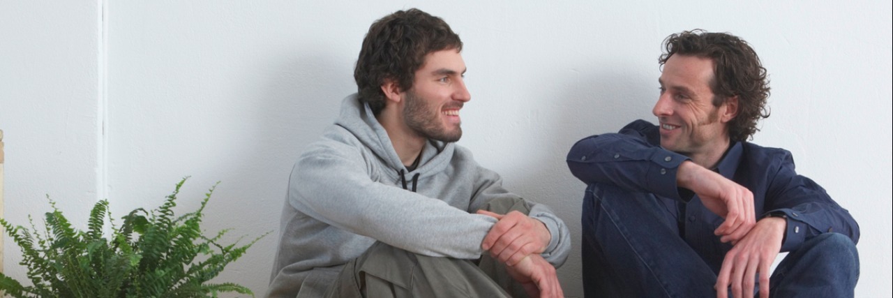 Talking to Family and Friends About Depression Men sitting on wooden floor, smiling