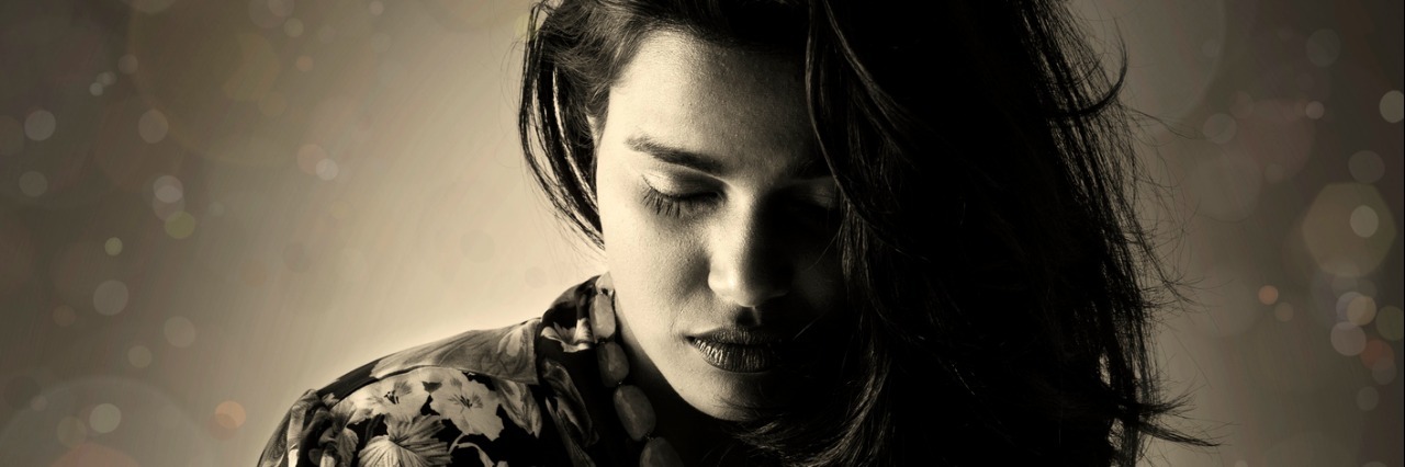 Things I've Learned in My Recovery From Major Depressive Disorder A beautiful young woman in black and white. grain added.