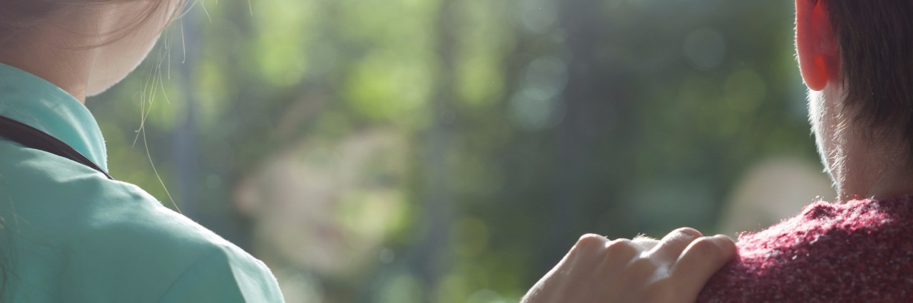 The Women by My Side in the Hospital as My Mother Lay Dying Supportive nurse with hand on shoulder of person in the hospital