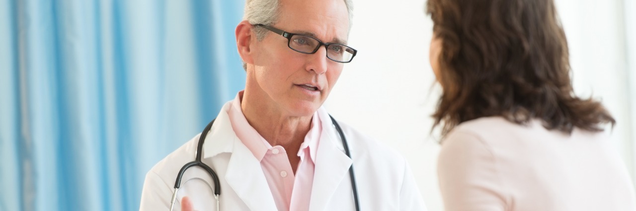 Doctors Assuming Mental Health Issues Existed Before Crohn's Diagnosis male doctor talking to female patient