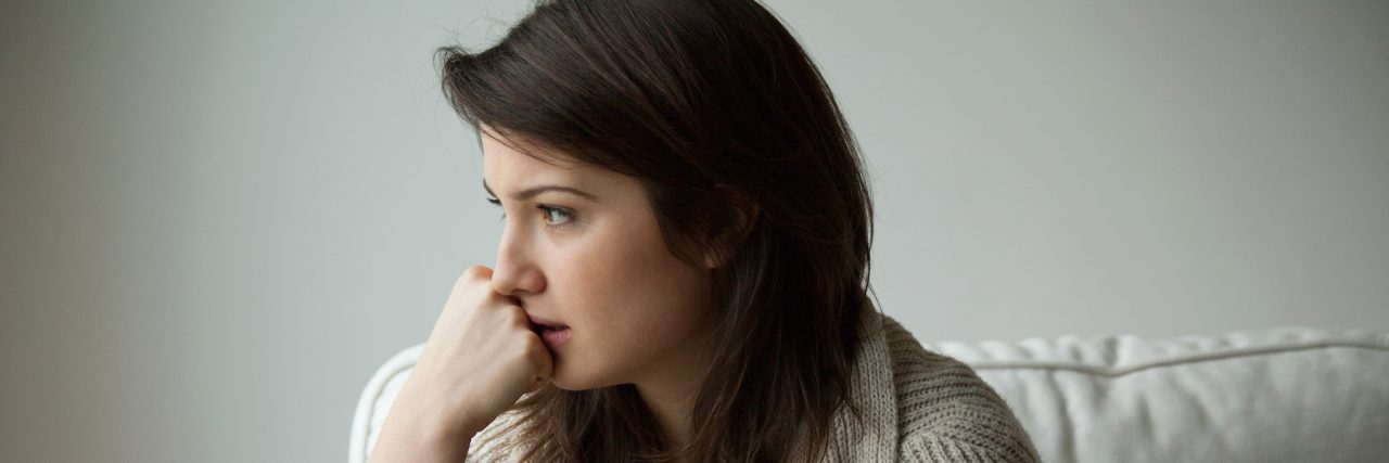 A Letter to My Anticipatory Anxiety or Anxiety for Upcoming Events Portrait of melancholy women sitting alone
