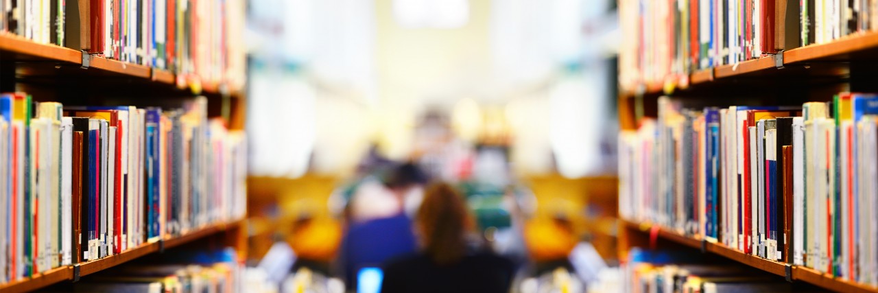 Daily Life as a College Student With Anxiety Bookshelf in public library, shallow DOF.