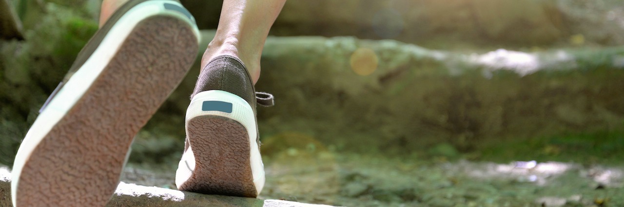 How Recovering from Lyme Disease Is Like Climbing the Basement Stairs feet walking up stairs towards sun