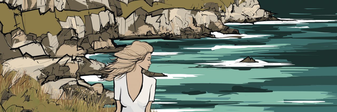 Having Depression With No Support System woman seated on the ground looking at the ocean