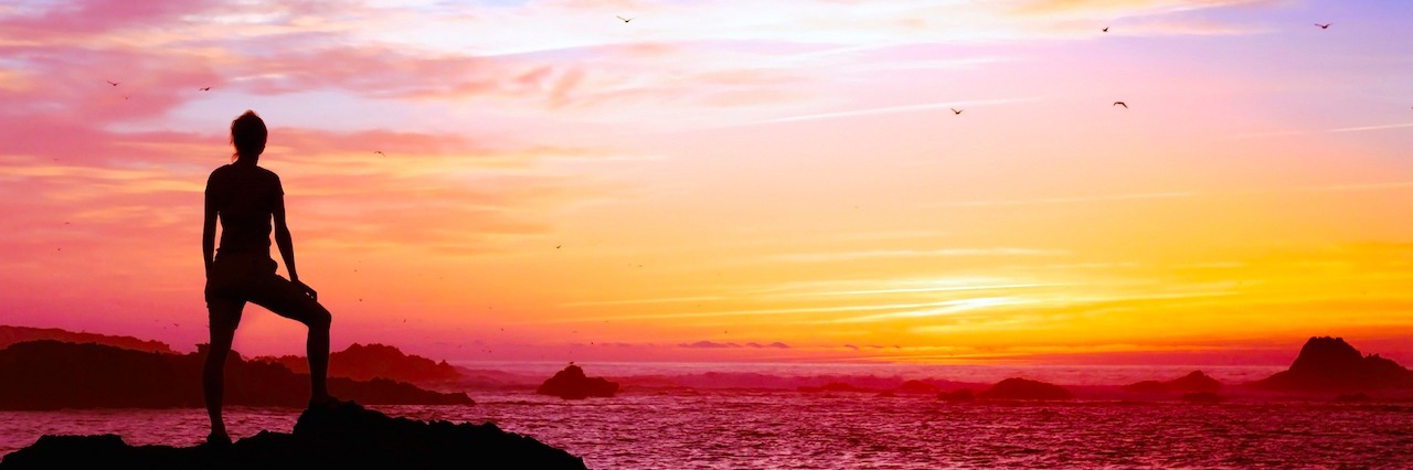 Reasons People With Mental Illnesses Are Strong AF silhouette of person enjoying beautiful sunset with view of ocean