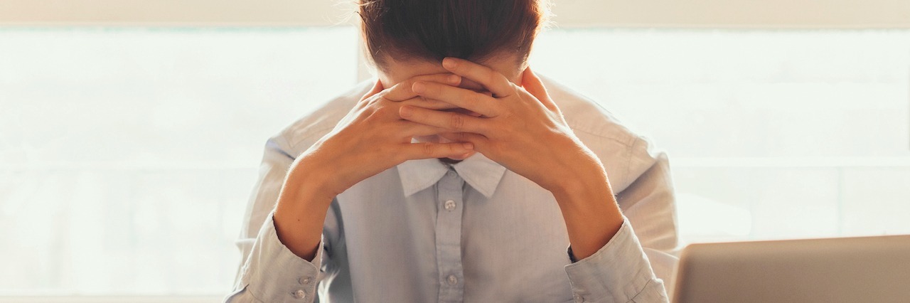 What It Feels Like When Depression Comes Unexpected During Work tired woman in an office