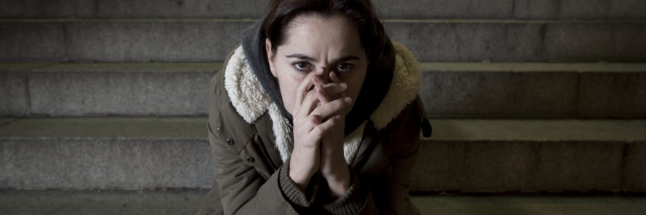 What I Hear When You Tell Me to 'Stop Being So Negative' sad woman alone on street subway staircase