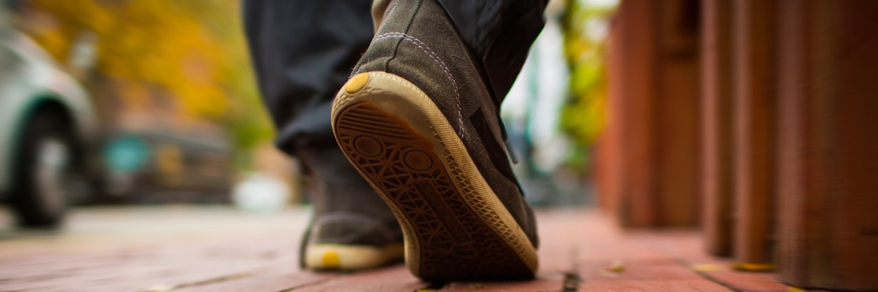 On the One-Year Anniversary of My Autism Diagnosis Close-up of shoes walking on a paved sidewalk