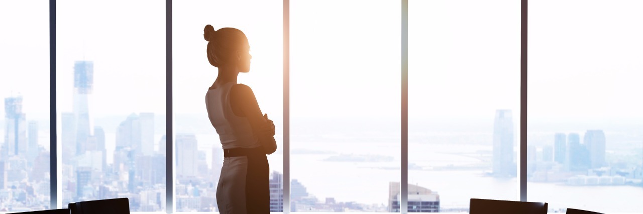 What Is a 'Functioning' Addict? woman looking at modern city