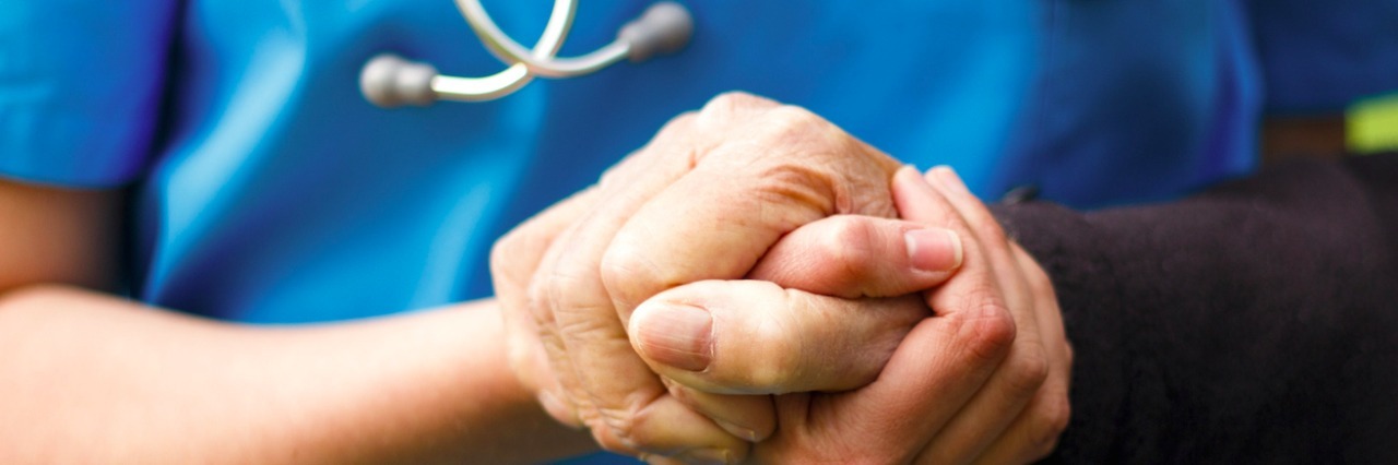 To the Nurses Who Are the Warmth and Light We Need Medical professional holding hand of patient