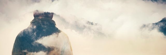 Double Exposure of Man and Cloudy Mountains forest Travel Lifestyle conceptual background