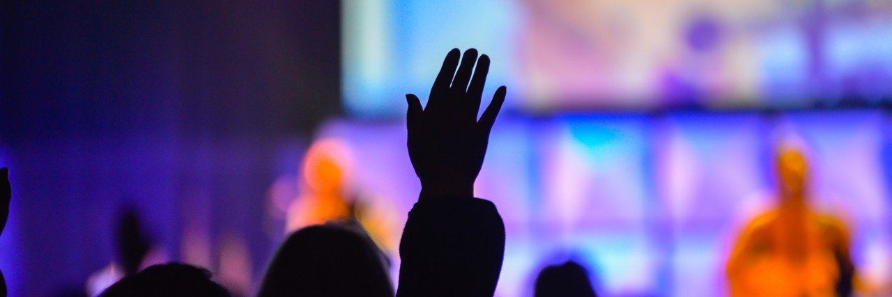 I Feel Anxiety When I Go to Church Worshipers holding their hands in the air at a Christian worship service