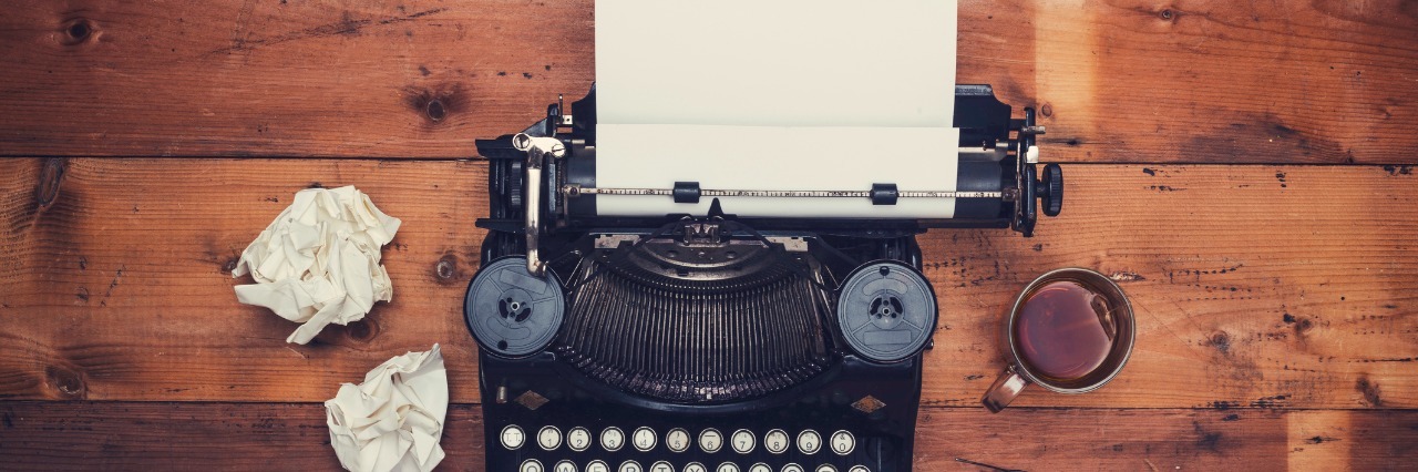 To My Children: Despite My Illness, I Have Tried My Best Top view thirties retro writers desk with typewriter on old wooden background table top.