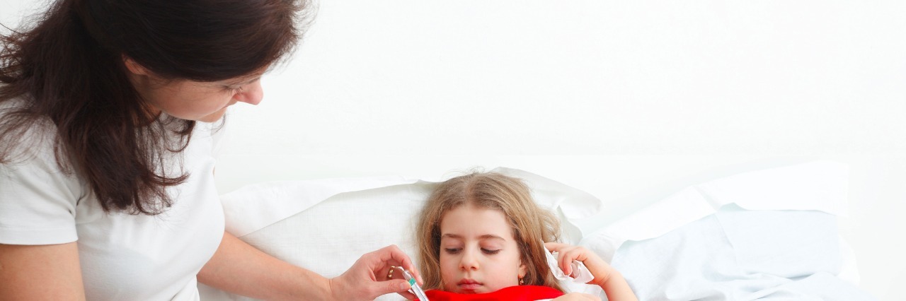 Finding My Voice in the Medical Maze of My Child's Care mom taking care of her sick child