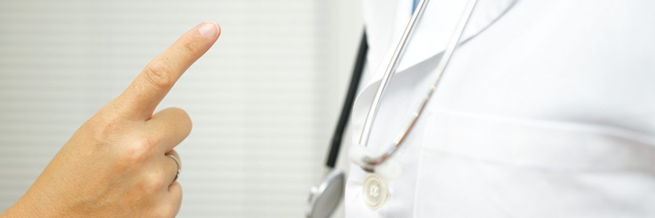 Harmful Comments Made About My Scoliosis by Medical Professionals Scolding a rude doctor.