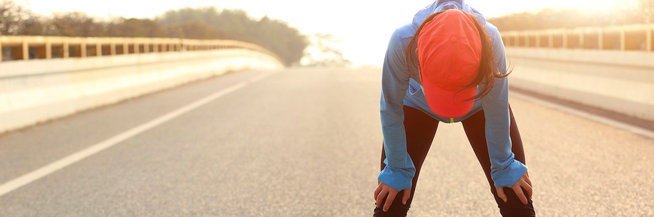 What People With Mental Illness Really Mean When They Say 'I'm Tired' tired woman runner taking a rest