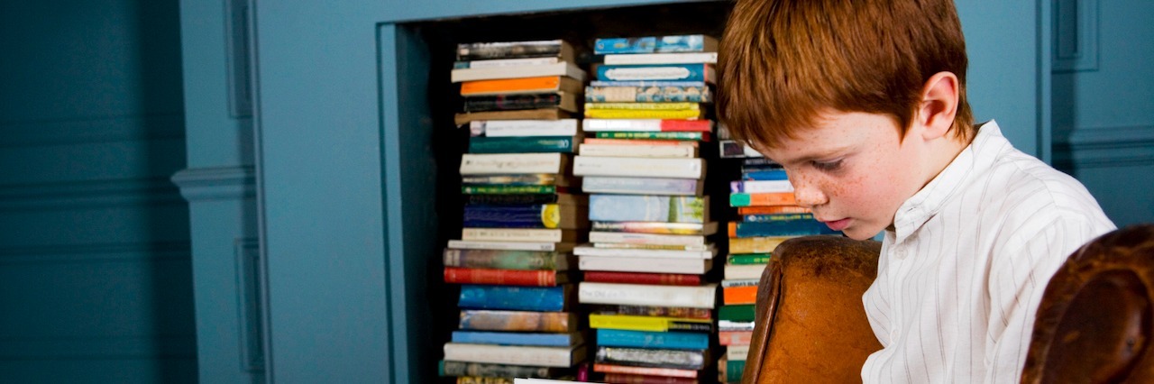 My 12-Year-Old Son Has Obsessive-Compulsive Disorder A young boy sitting and reading