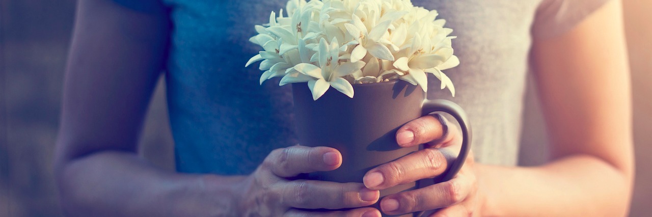 For Those Who Wonder Why I Self-Harm woman holding a flower pot