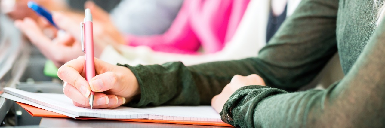 Talking About My Mental Illness in Front of Others college students taking notes