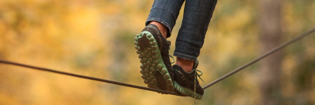 Anxiety Makes Me Feel Like Everyone Is Watching Girl walking along a tightrope in the trees.