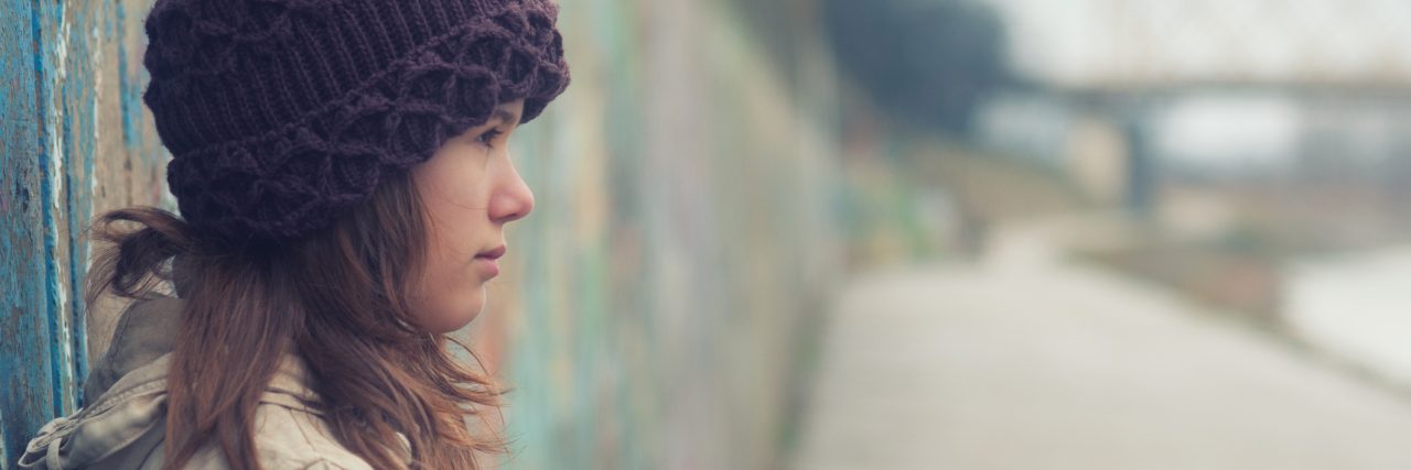 I Was Diagnosed With PTSD at 14, but There Was No Place for Me Lonely teenage girl on moody winter day