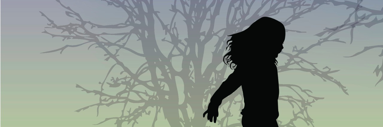 Why I'm Thankful My Parents Pursued My Autism Diagnosis silhouette of child playing on grass near tree